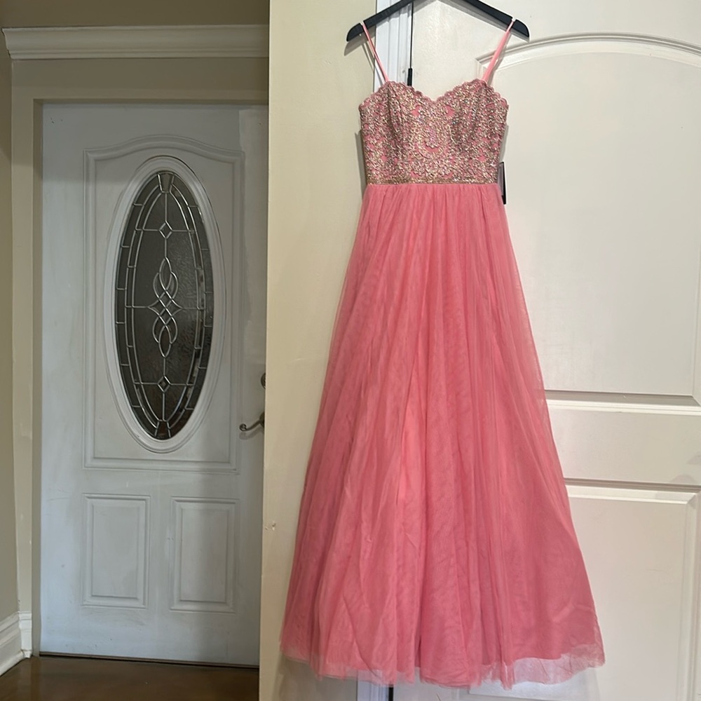 Special  occasion  dress new with tags in a beautiful pink and gold  sequin